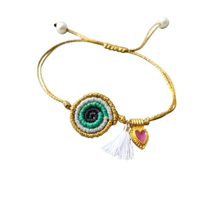 Boho βραχιόλι μακραμέ ματάκι με ορειχάλκινη καρδούλα και λευκή φουντίτσα. - ορείχαλκος, καρδιά, κορδόνια, μάτι, boho